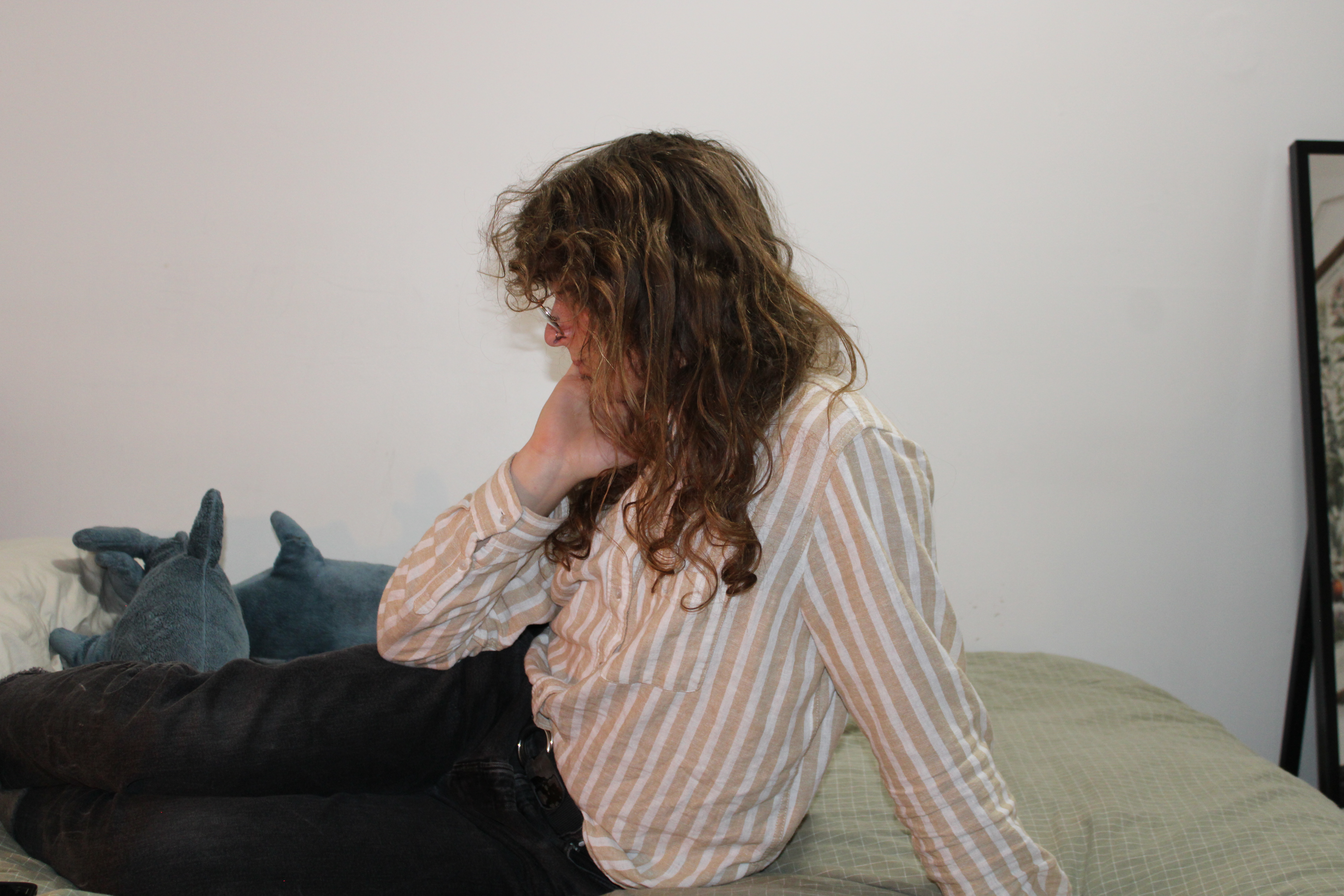 the owner of this blog sitting on her bed